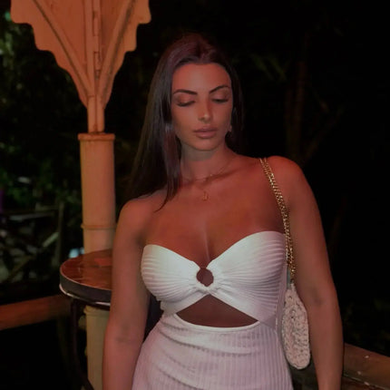 "An elegant bodycon silhouette with a refined, curve-enhancing fit."